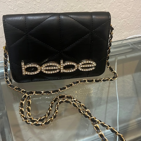 bebe Handbags - Quilted Bebe mini black purse was brand new